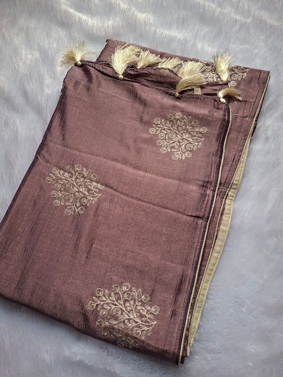 Plum Thread Embroidery Saree with Tassels — folded