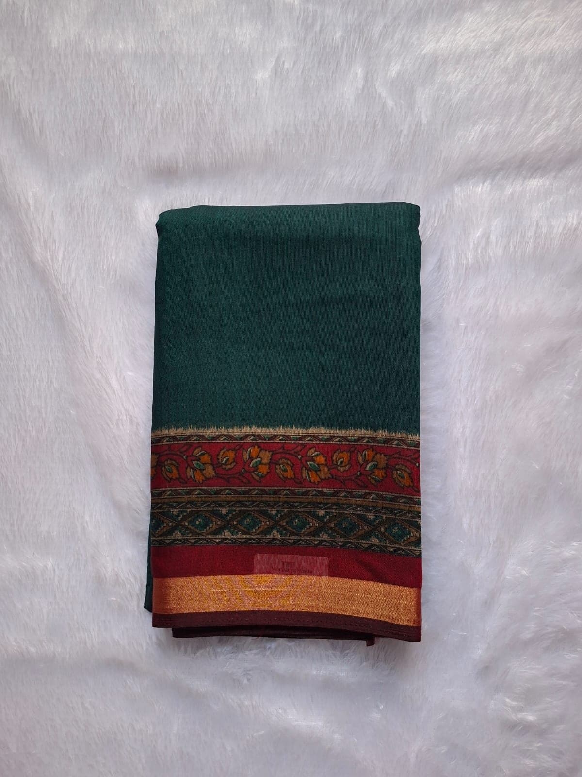 Teal green cotton blend saree with a printed border