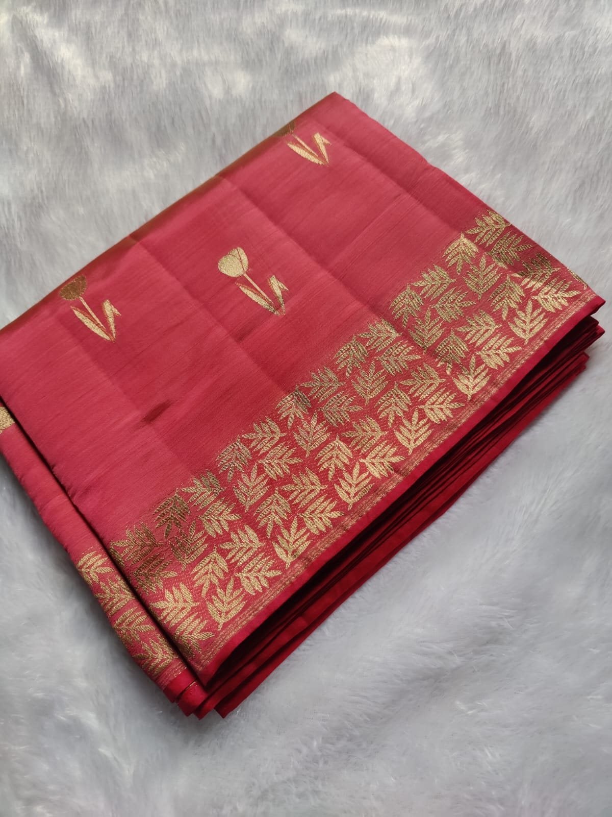 Coral Red semi raw silk saree with rich zari, folded