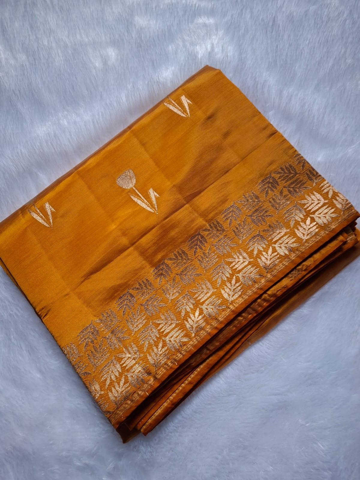 Mustard semi raw silk saree with rich zari, folded