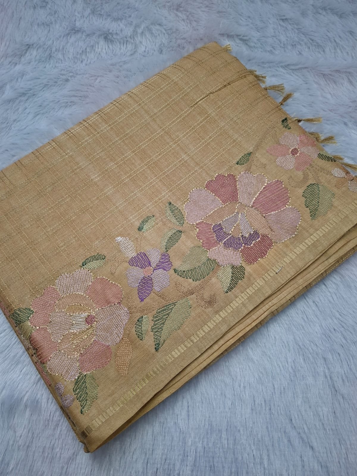 Beige viscose tussar saree with floral checks, folded