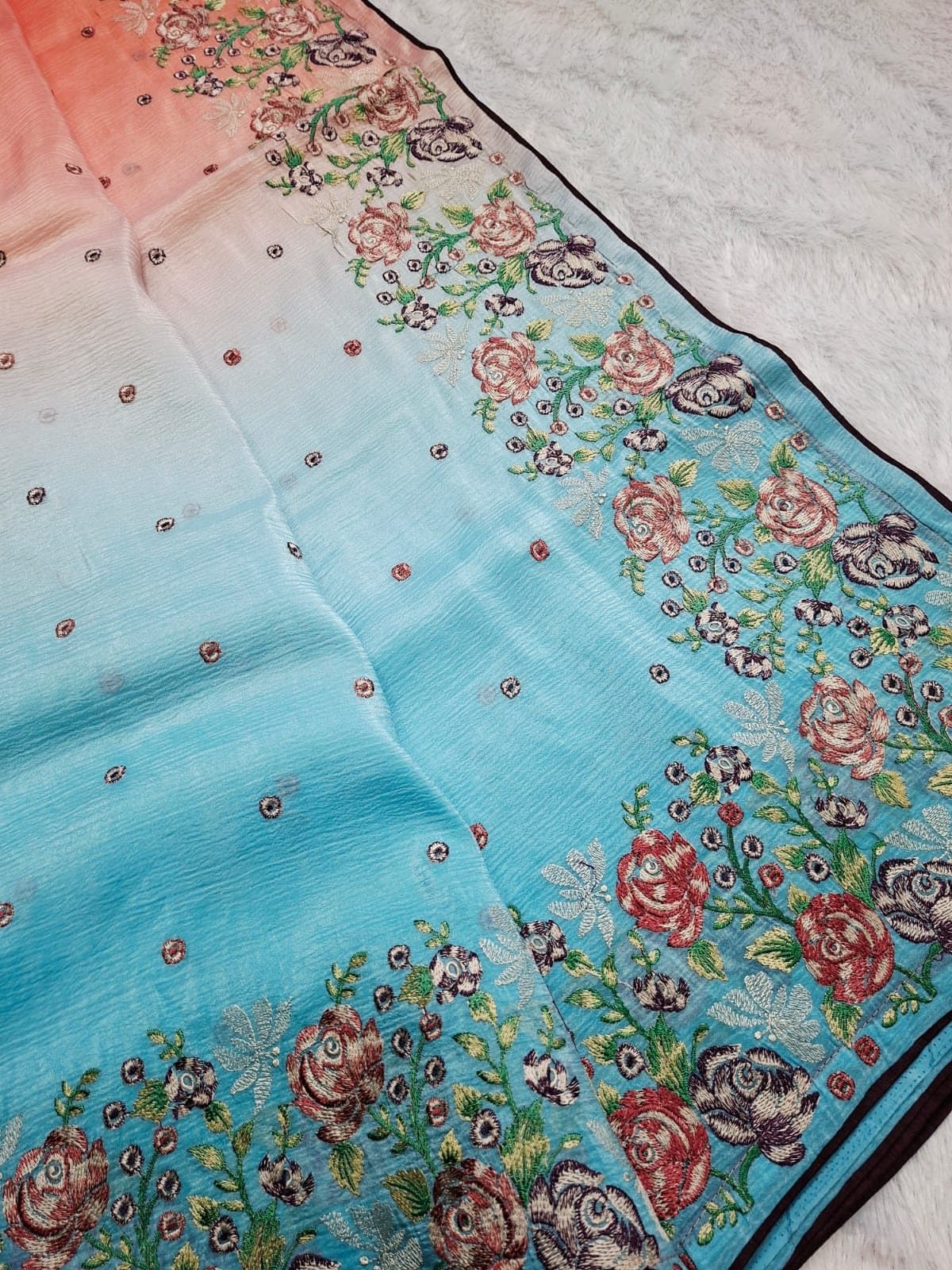 Floral embroidery on an ombré windy crush saree