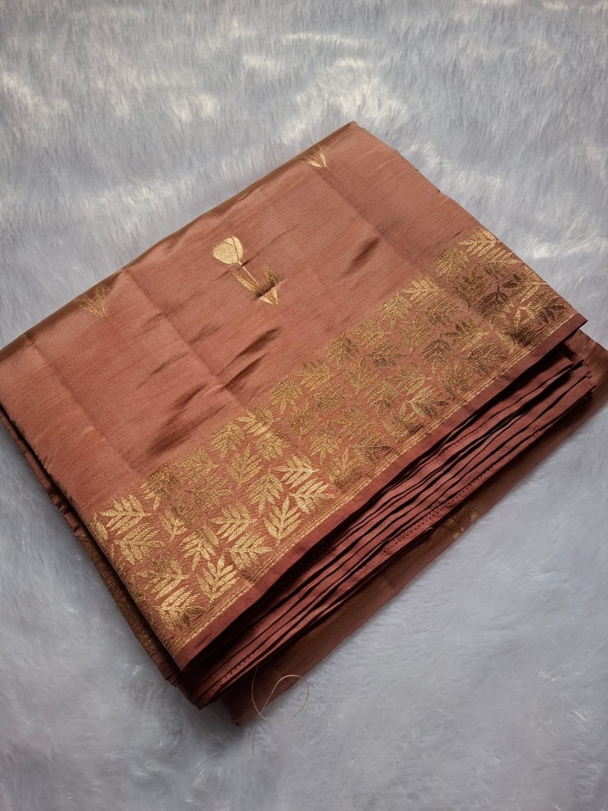 Dusty Rose semi raw silk saree with rich zari, folded