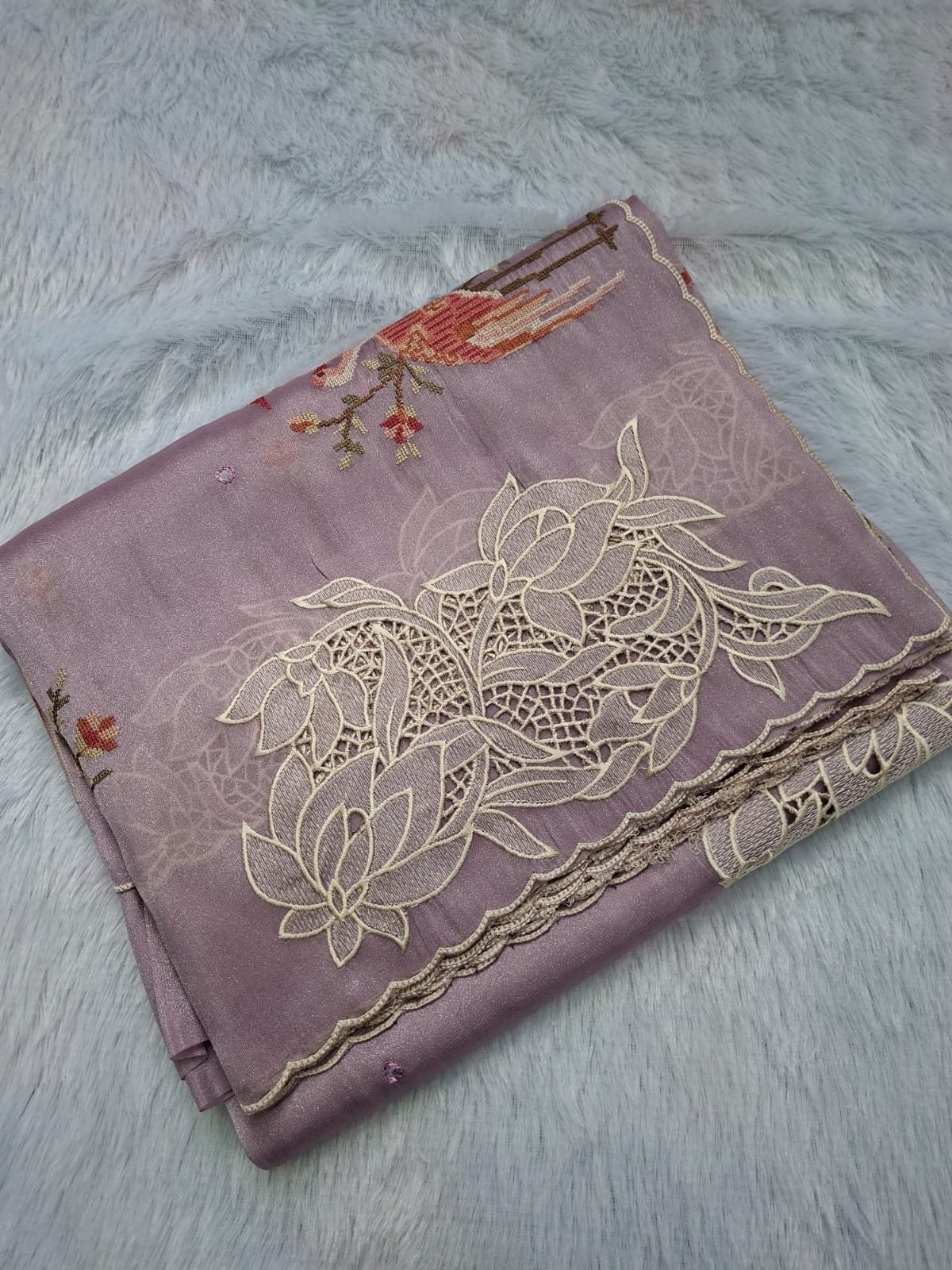 Lilac pure tissue saree with lotus cut work and cross-stitch, folded