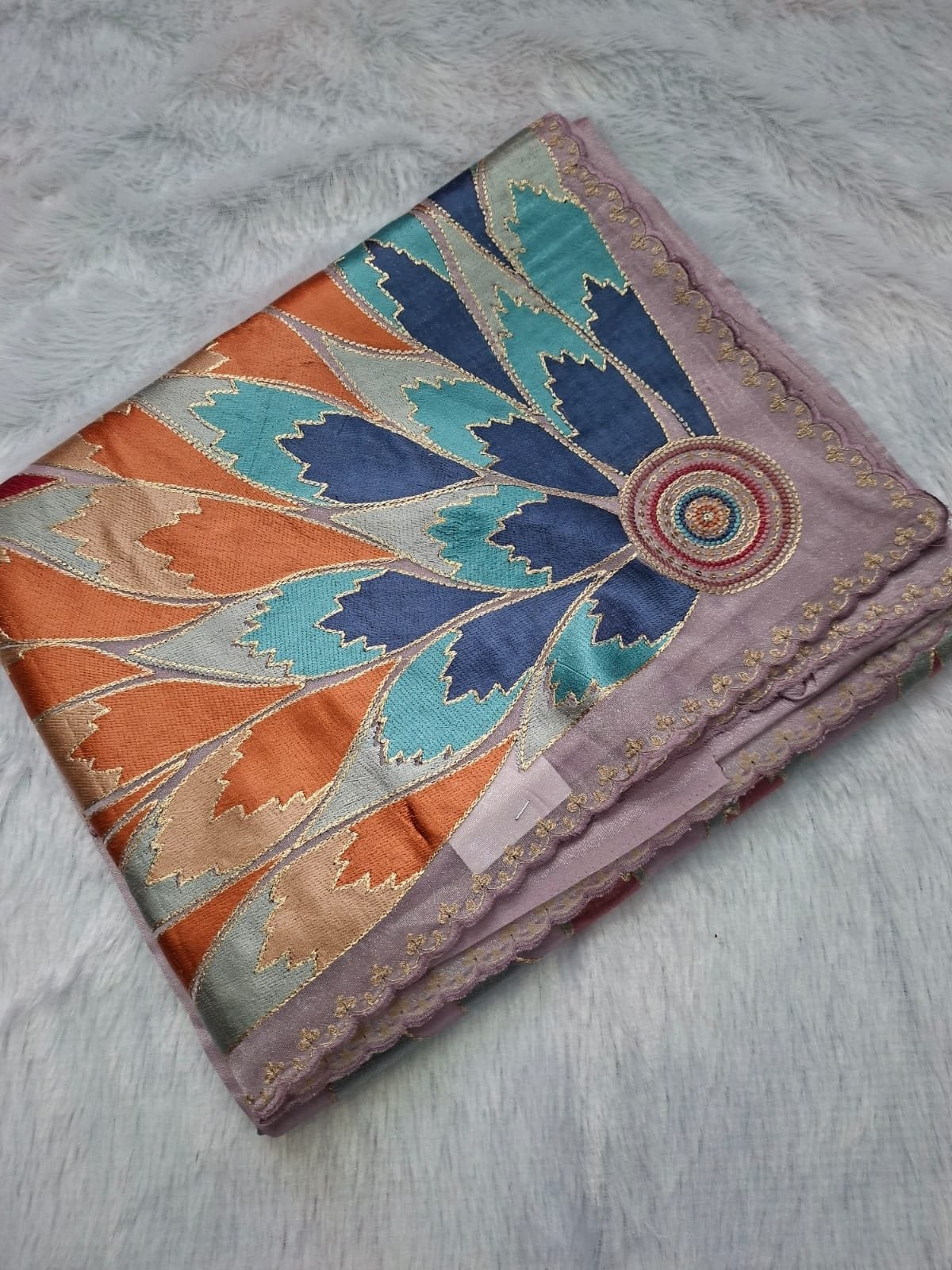 Lilac pure tissue saree with multicolour petal pallu, folded