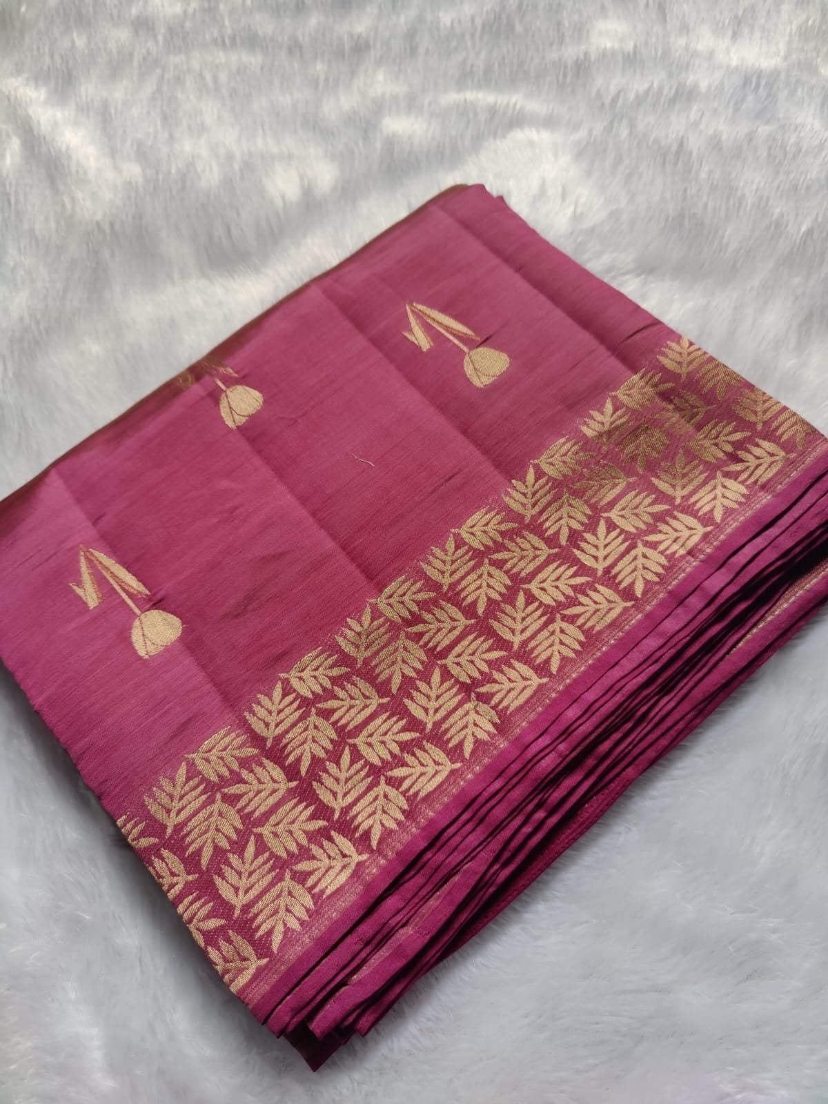Magenta semi raw silk saree with rich zari, folded