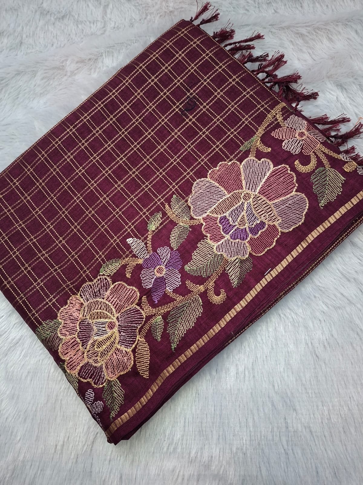 Maroon viscose tussar saree with floral checks, folded