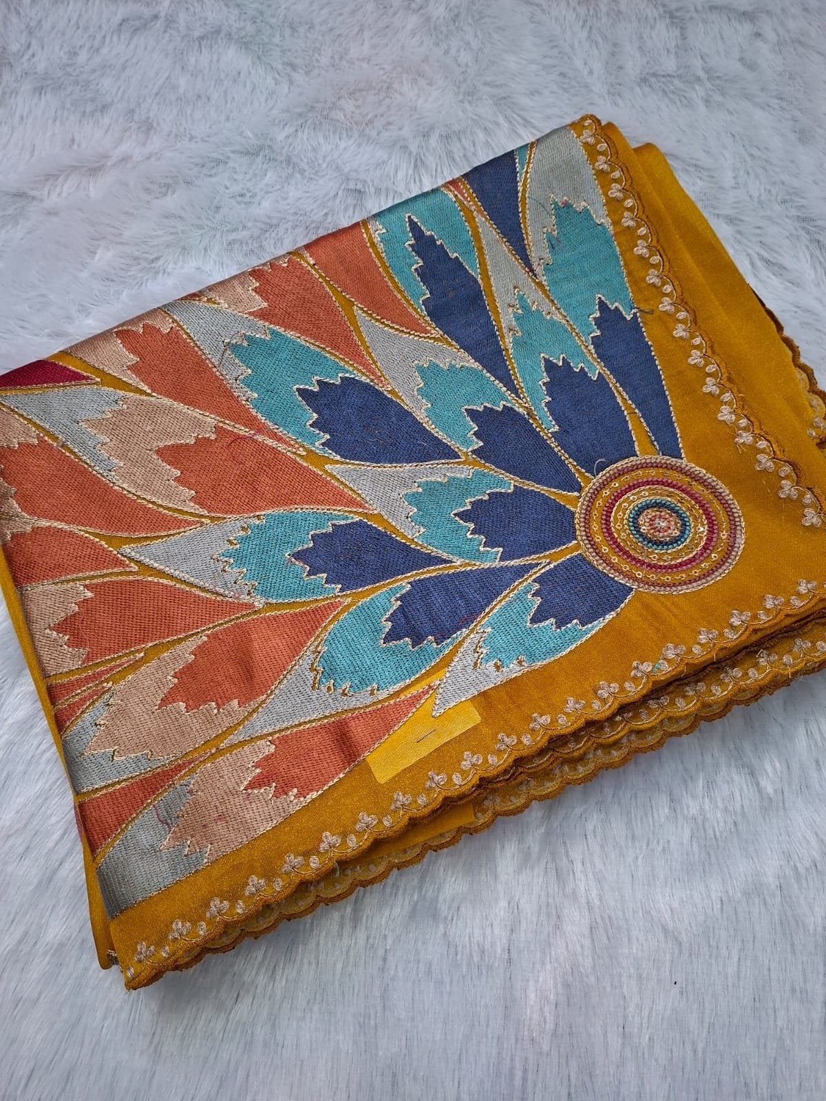 Mustard pure tissue saree with multicolour petal pallu, folded