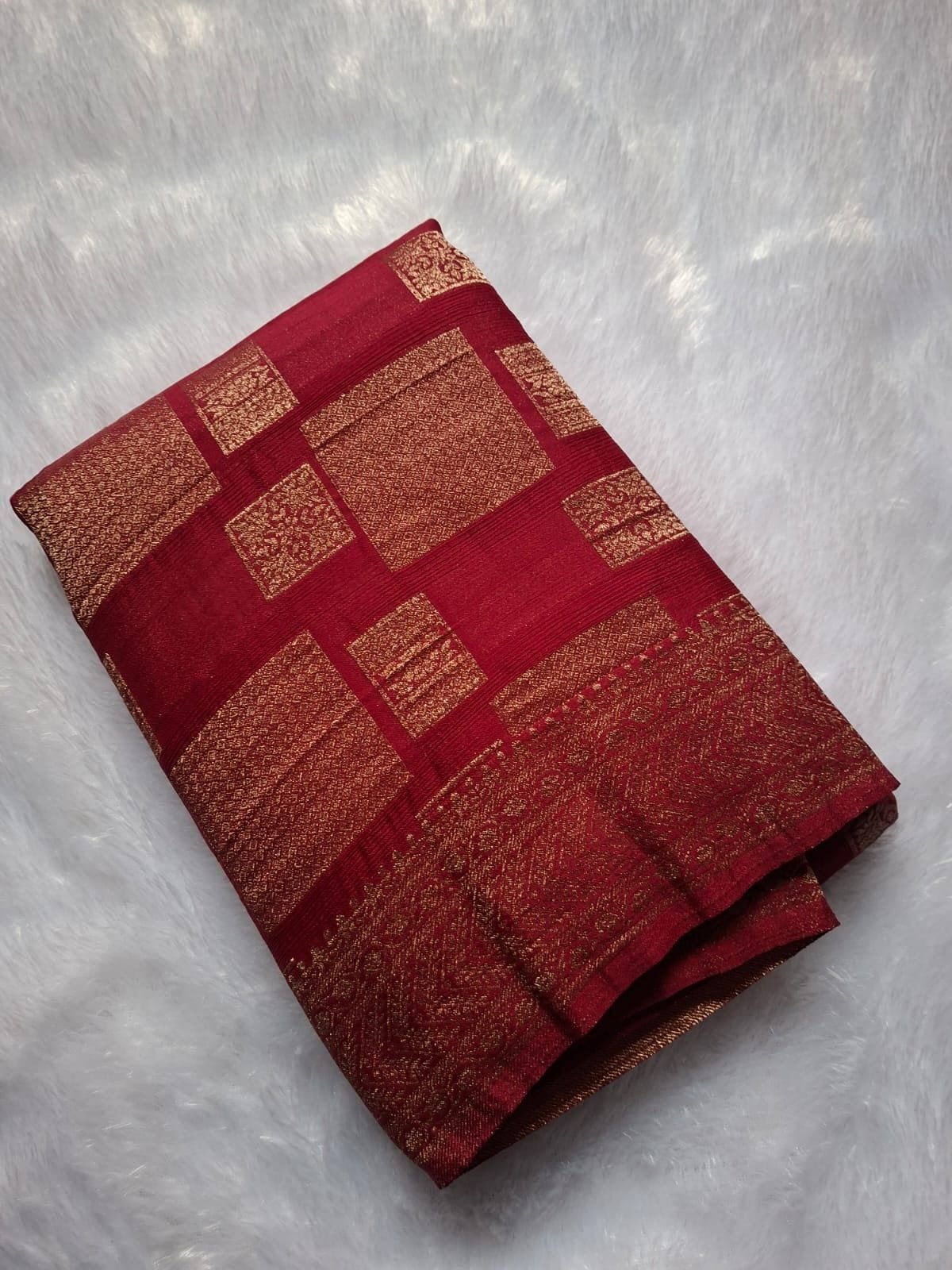 Rani Red premium georgette saree with geometric zari blocks, folded