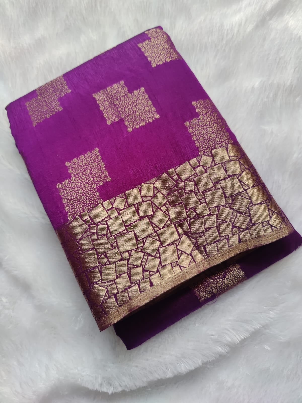 Violet semi silk saree, folded to show the zari border