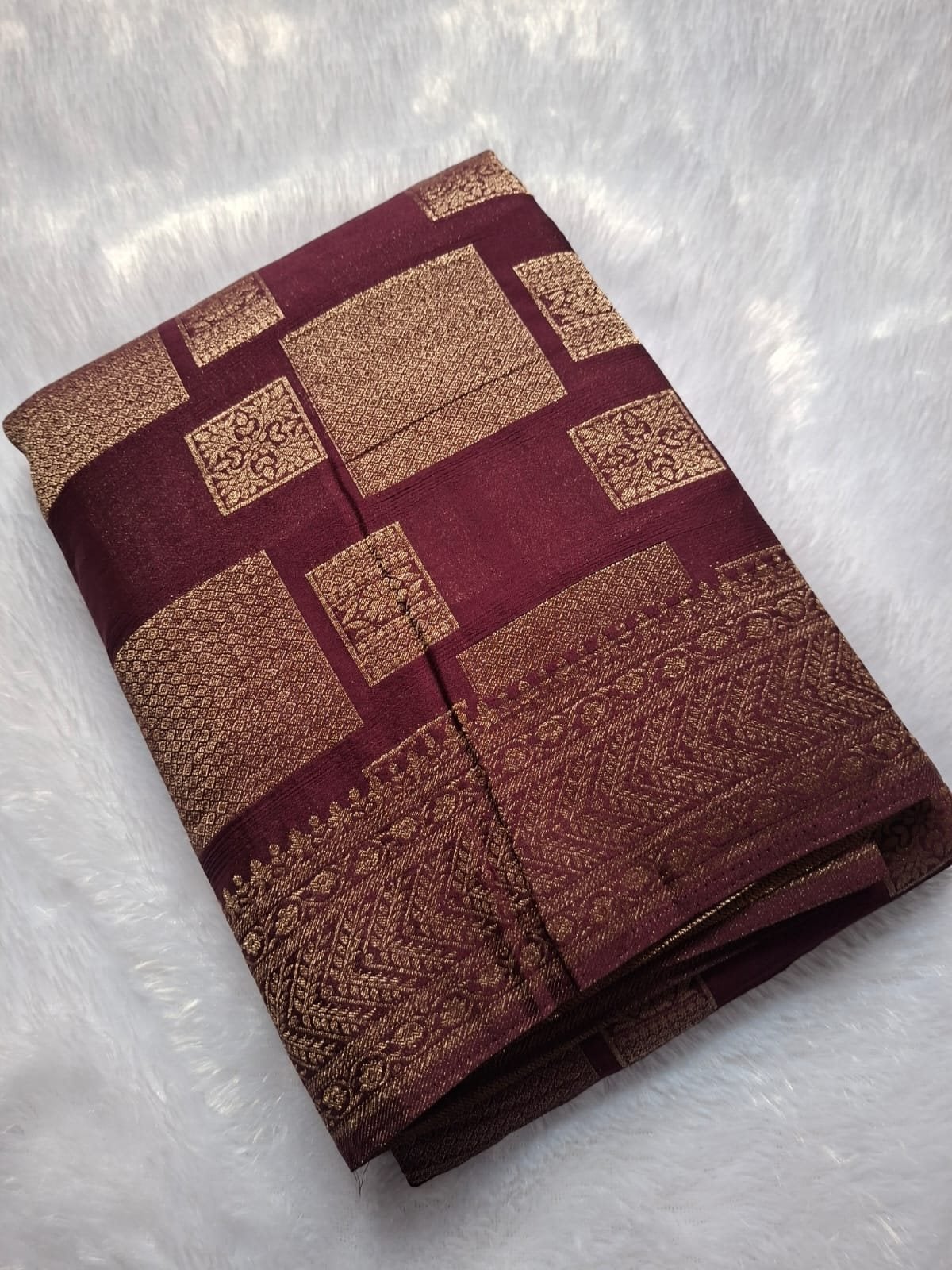 Wine premium georgette saree with geometric zari blocks, folded